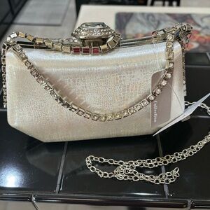 Cute little party clutch! Silver with rhinestones. Brand new!